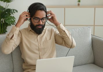 Arabian ethnic businessman working online with laptop tired stressed Indian exhausted business man Arabian ethnic businessman working online with laptop tired stressed Indian exhausted business man